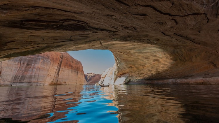 Lost Eden Canyon Lake Powell Utah with kayaker in the background