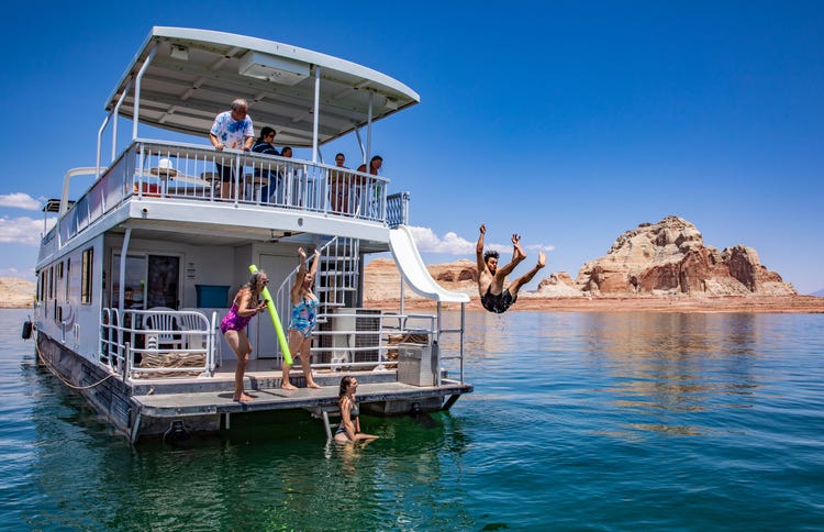 group of people enjoying time on a houseboat on Lake Powell