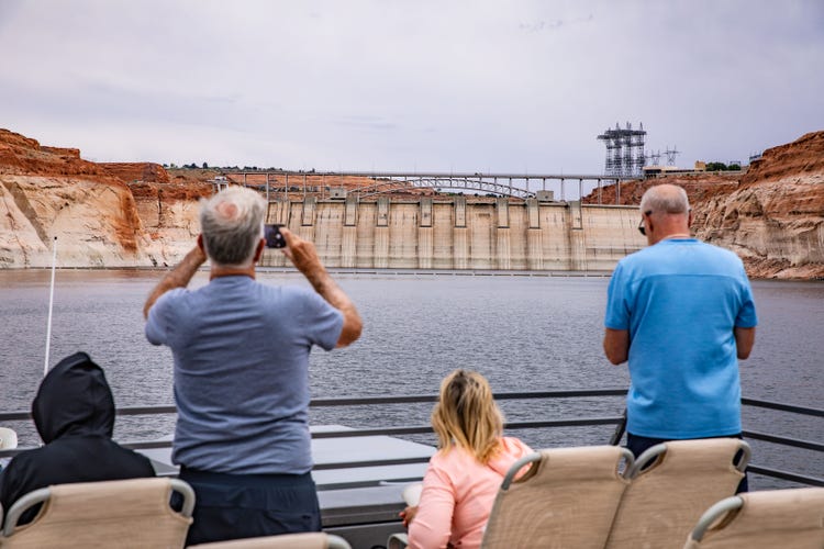 people on a Boat tour of the scenic Glen Canyon Dam
