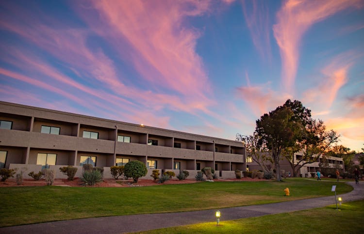 pink clouds above Lake Powell Resort exterior at sunset